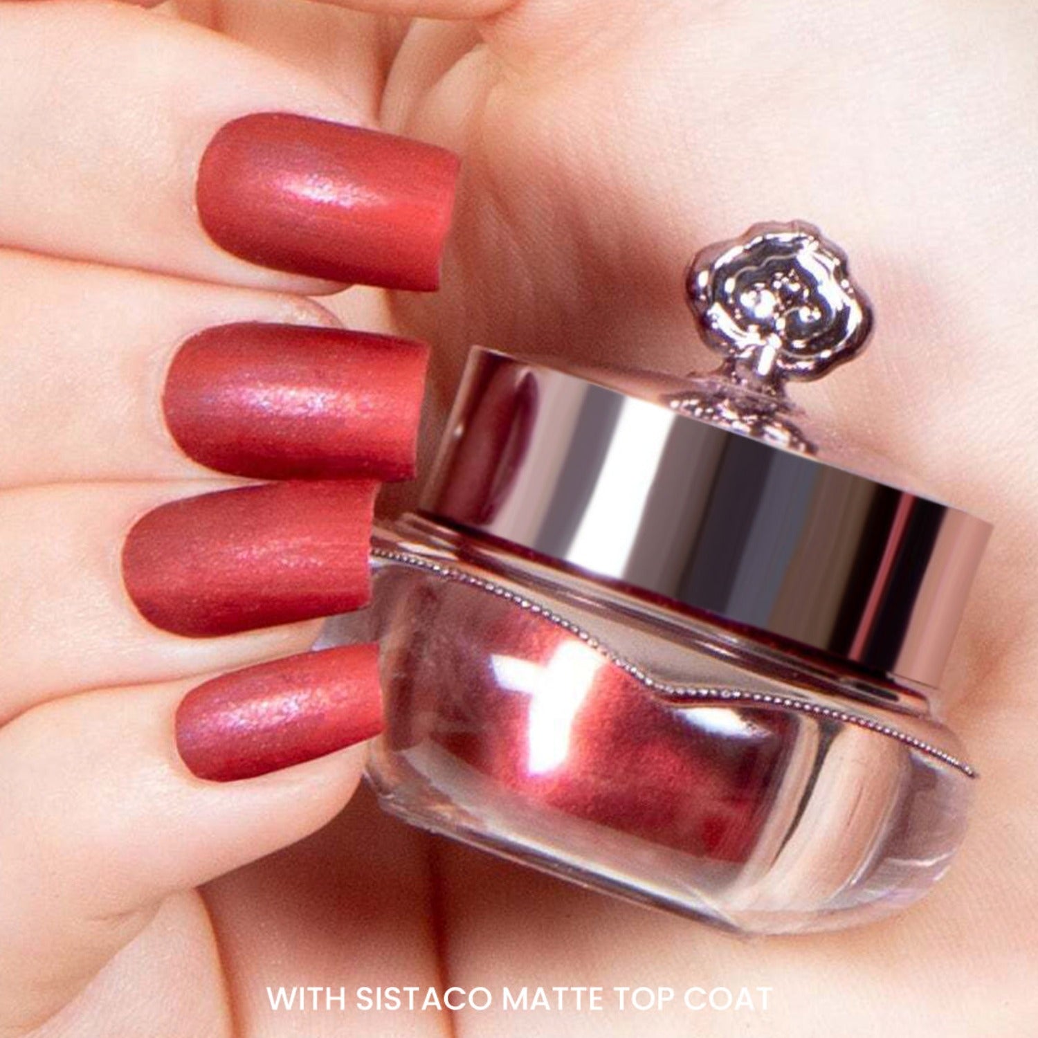 Red nails after applying matte top coat