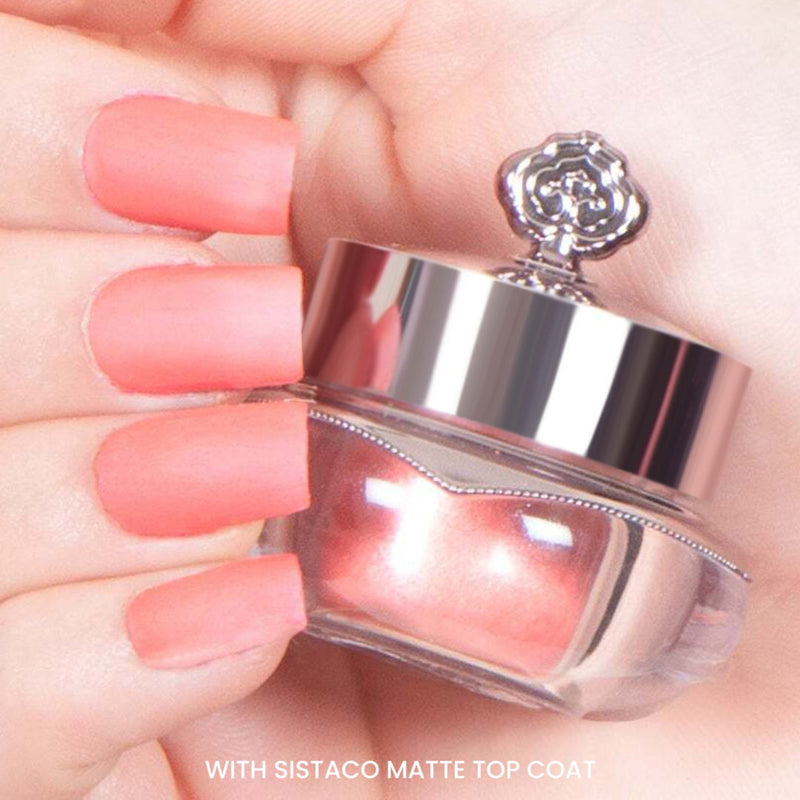 Nude Peach nails after applying matte top coat